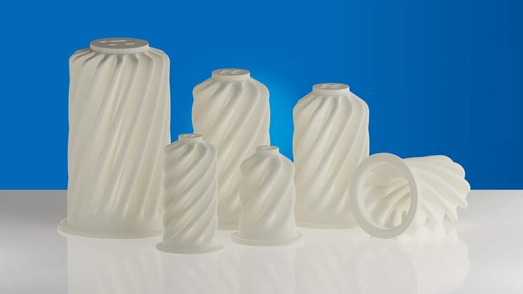 Industrie-Filter, in verschiedenen Größen, die fast aussehen wie die Deckel von Sprühsahne