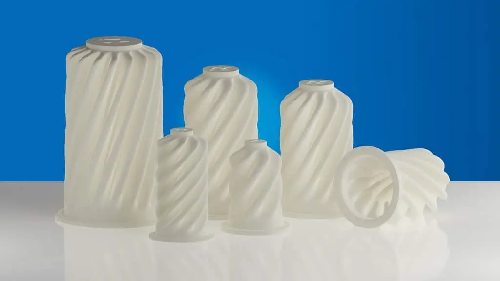 Industrie-Filter, in verschiedenen Größen, die fast aussehen wie die Deckel von Sprühsahne