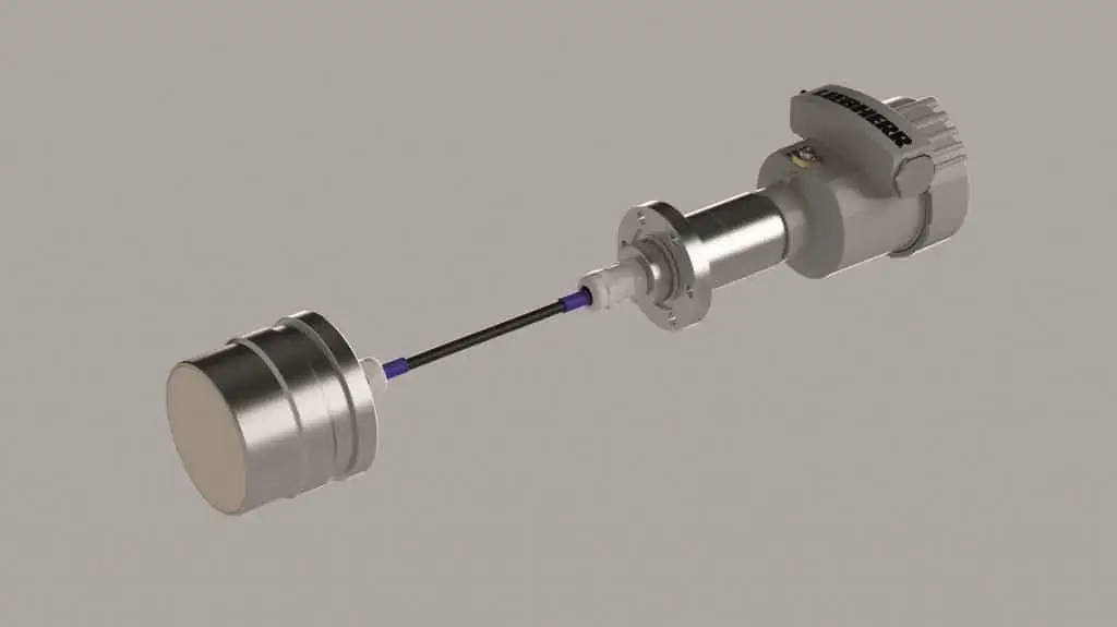 Breiter runder Sensor vorne links. Hinter dem Sensorkopf ein Kabel. Am anderen Ende des Kabels die Steuerungseinheit.
