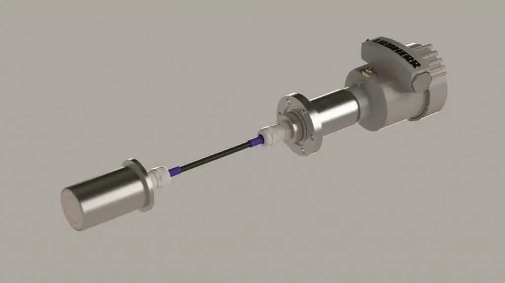 Schmaler runder Sensor vorne links. Hinter dem Sensorkopf ein Kabel. Am anderen Ende des Kabels die Steuerungseinheit.