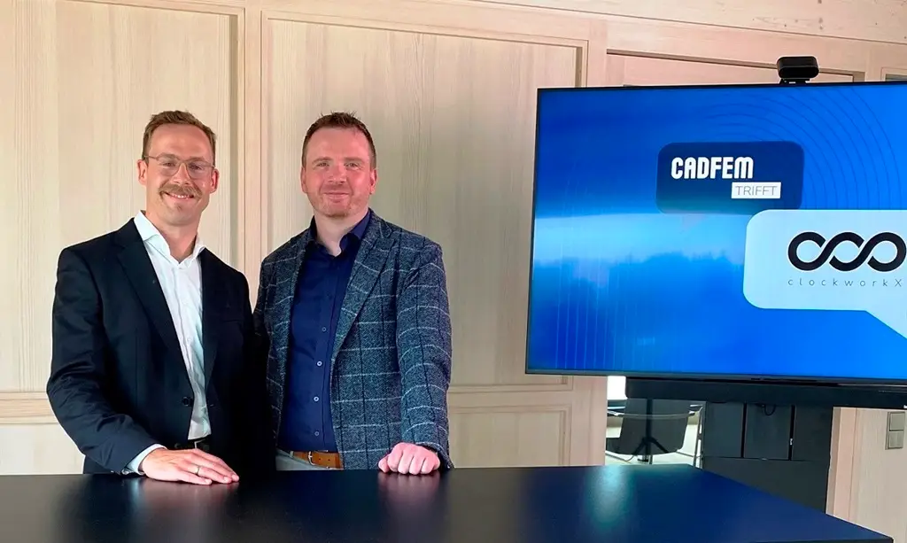 An einem Stehtisch, vor einem Bildschirm,) Dr. Christian Geiss, Geschäftsführer der clockworkX GmbH, und Josef Overberg, Geschäftsführer der CADFEM Germany GmbH (v.l.