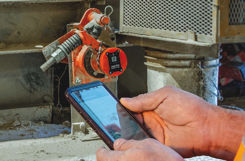 Mobiltelefon und im Hintergrund der Positionsanzeiger